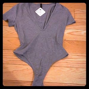 NWT Grey plunging neck line short sleeve body suit